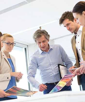 close up of colleagues working on a tablet