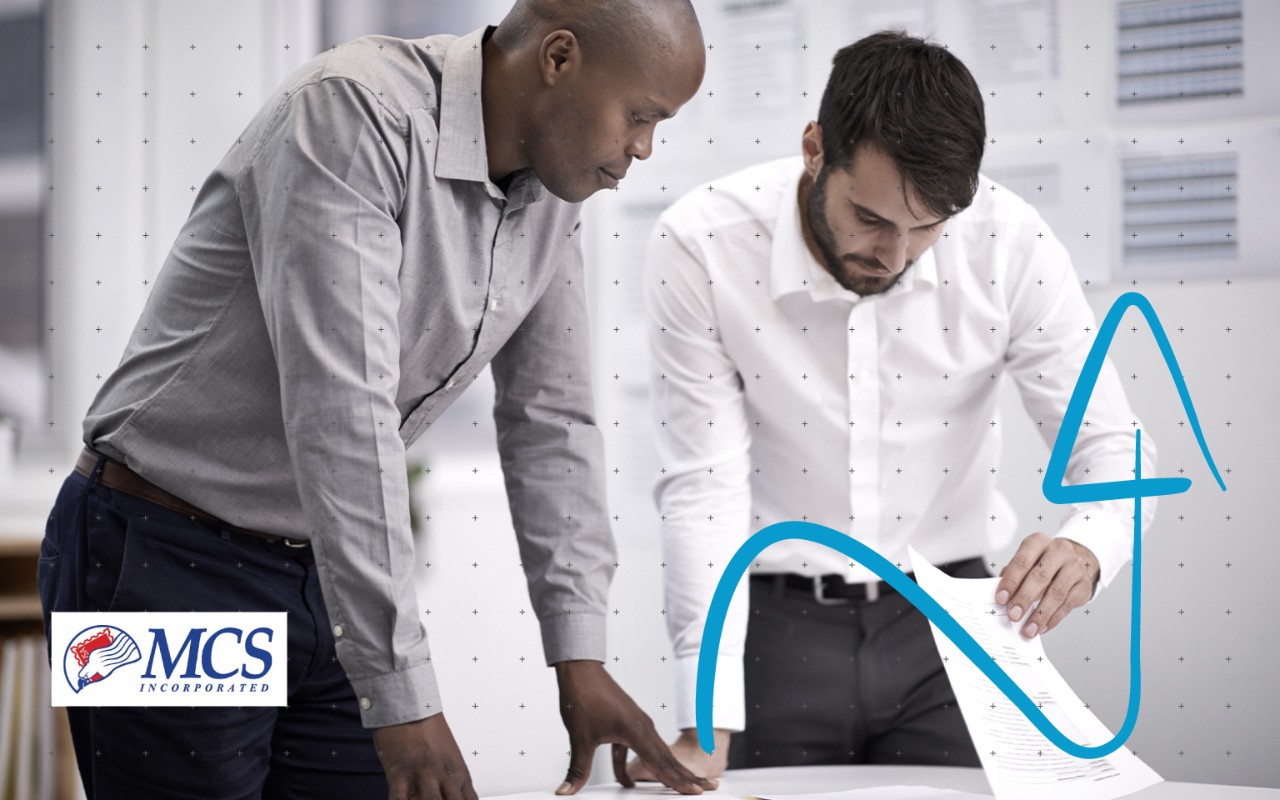 Two men looking over paperwork