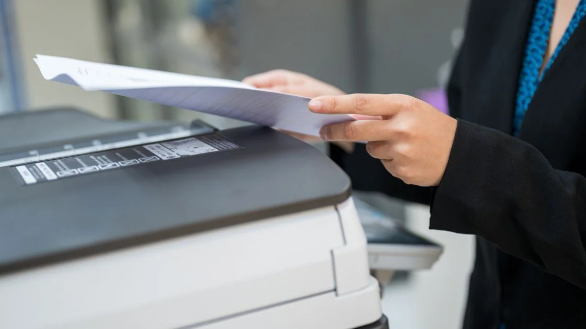 female-staff-is-copying-photocopier-office female-staff-is-copying-photocopier-office