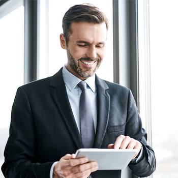 How to perfect remote working designer looking at his smartphone